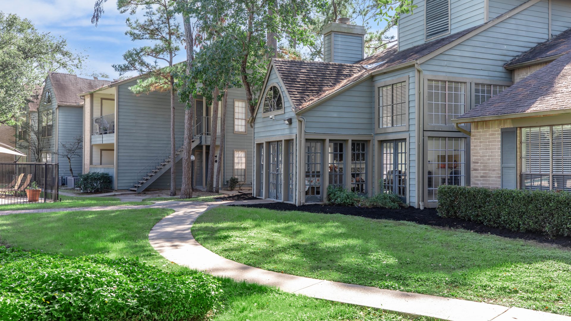 a house that is in the middle of a grassy area